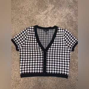 Black and white cropped sweater.